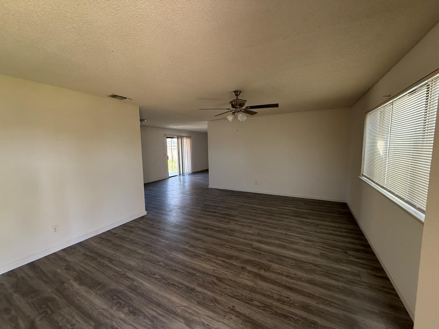 16385 North D Street Madera, CA 93638 - Photo 26 of 26 a view of an empty room with wooden floor and a window