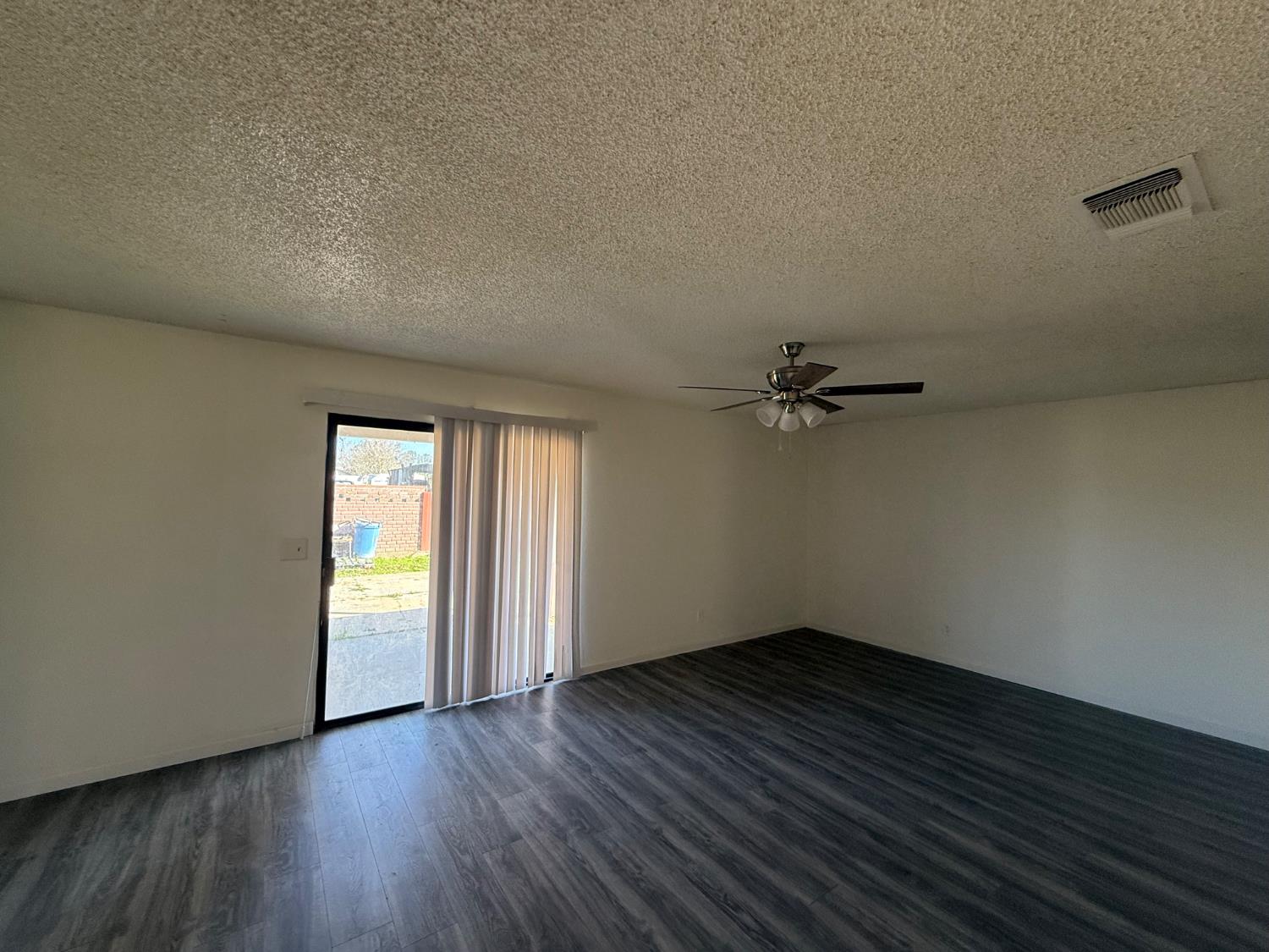 16385 North D Street Madera, CA 93638 - Photo 6 of 26 wooden floor in an empty room