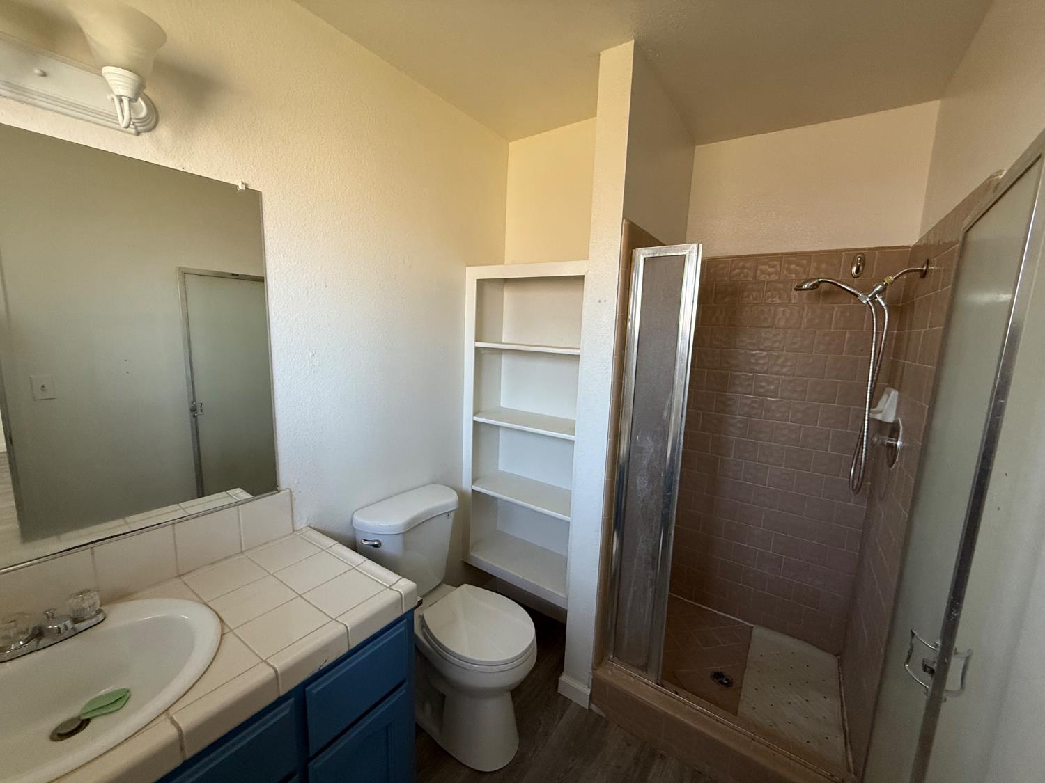 16385 North D Street Madera, CA 93638 - Photo 8 of 26 a bathroom with a sink toilet and shower