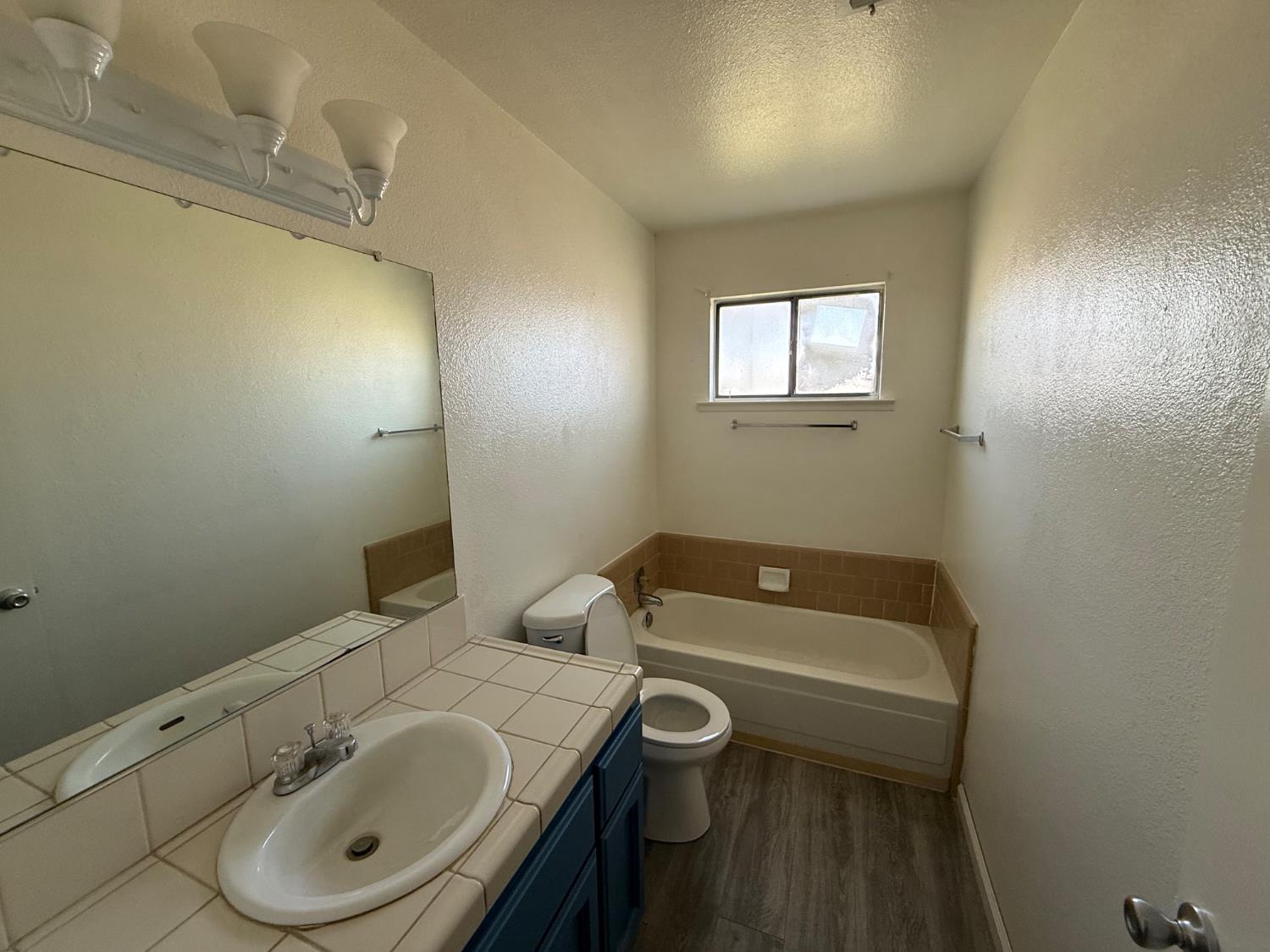 16385 North D Street Madera, CA 93638 - Photo 9 of 26 a bathroom with a sink a toilet and shower