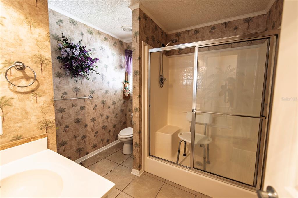 53 Rotterdam Punta Gorda, FL 33950 - Photo 11 of 26 a bathroom with a shower toilet and sink