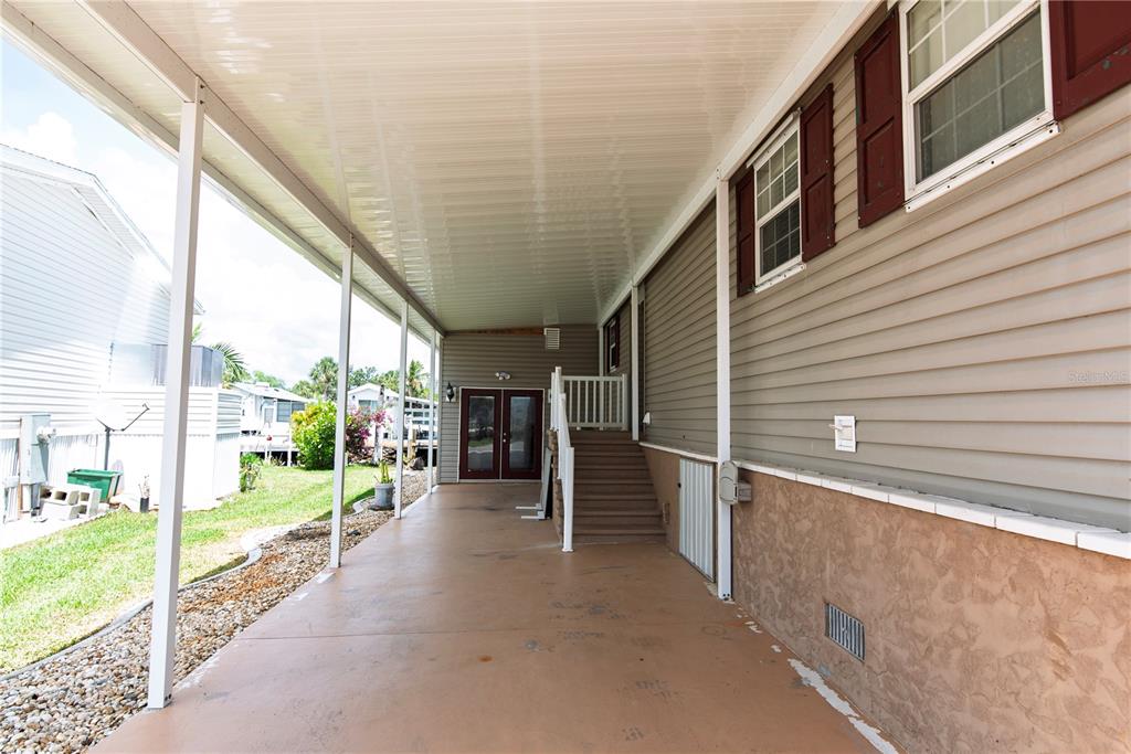 53 Rotterdam Punta Gorda, FL 33950 - Photo 14 of 26 a view of a porch with wooden stairs
