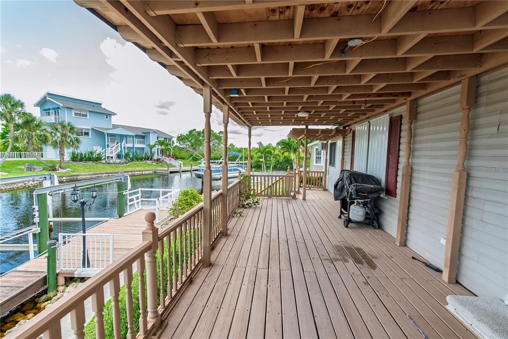 53 Rotterdam Punta Gorda, FL 33950 - Photo 15 of 26 a view of a balcony with wooden floor