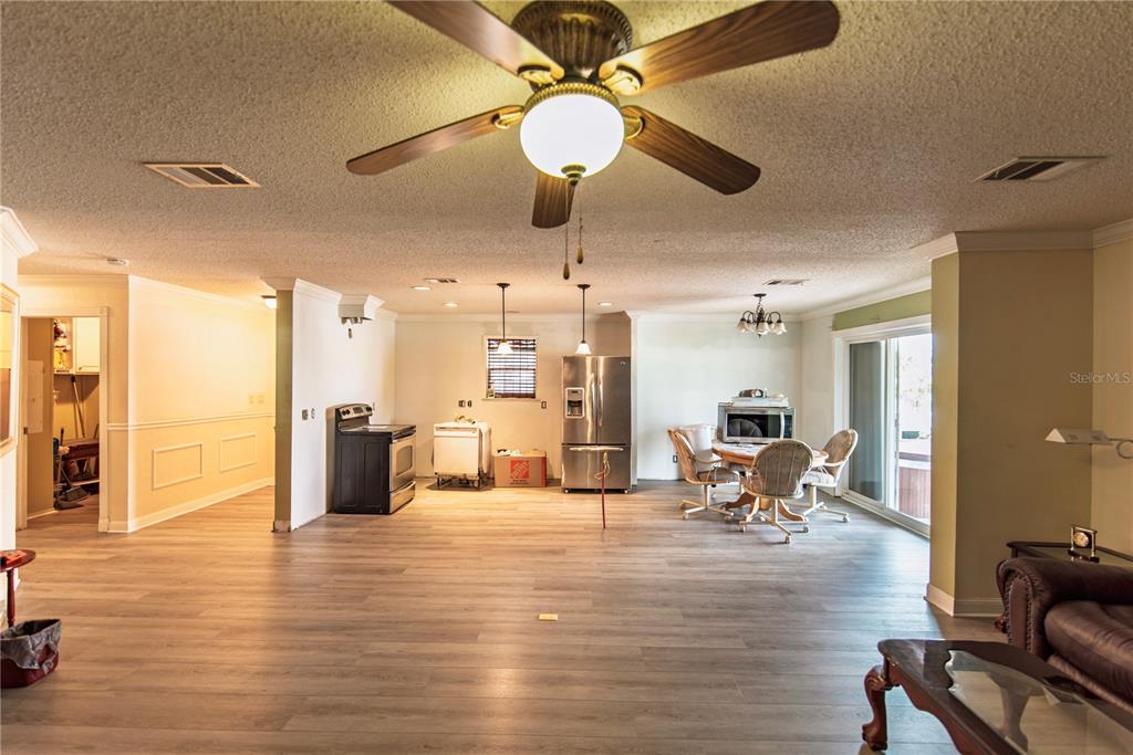 53 Rotterdam Punta Gorda, FL 33950 - Photo 6 of 26 a living room with fireplace furniture and a chandelier