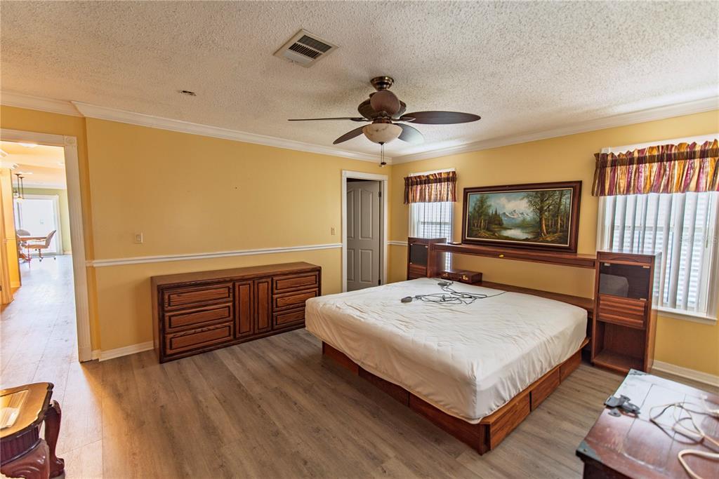 53 Rotterdam Punta Gorda, FL 33950 - Photo 8 of 26 a bedroom with a bed and wooden floor