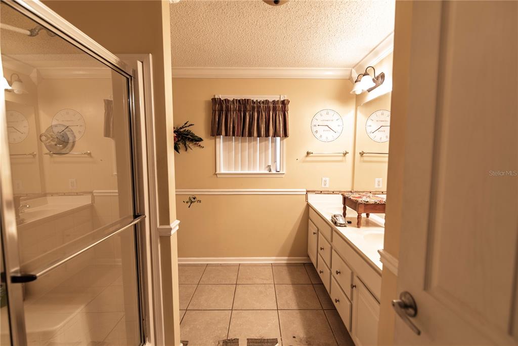 53 Rotterdam Punta Gorda, FL 33950 - Photo 9 of 26 a bathroom with a tub and shower