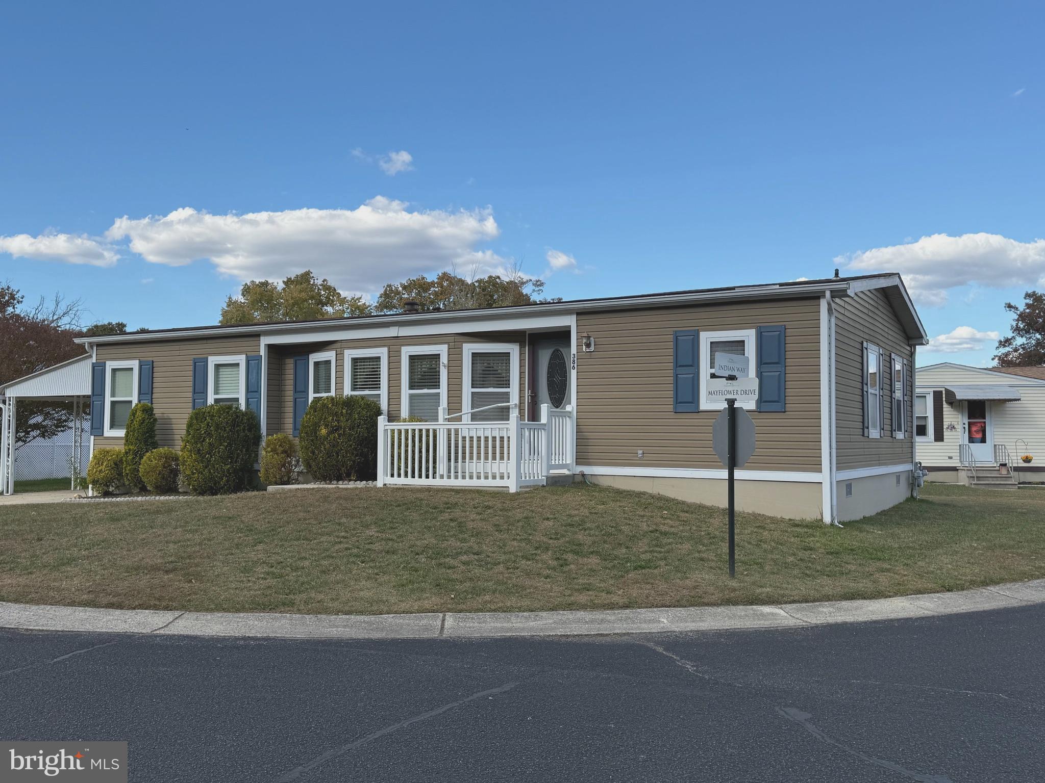 386 Indian Way Buena, NJ 08310 - Photo 3 of 53 a front view of a house with a yard