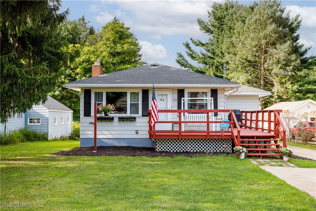 1153 Krumroy Road Akron, OH 44306 - Photo 1 of 26 View of front of home featuring a wooden deck and a front yard