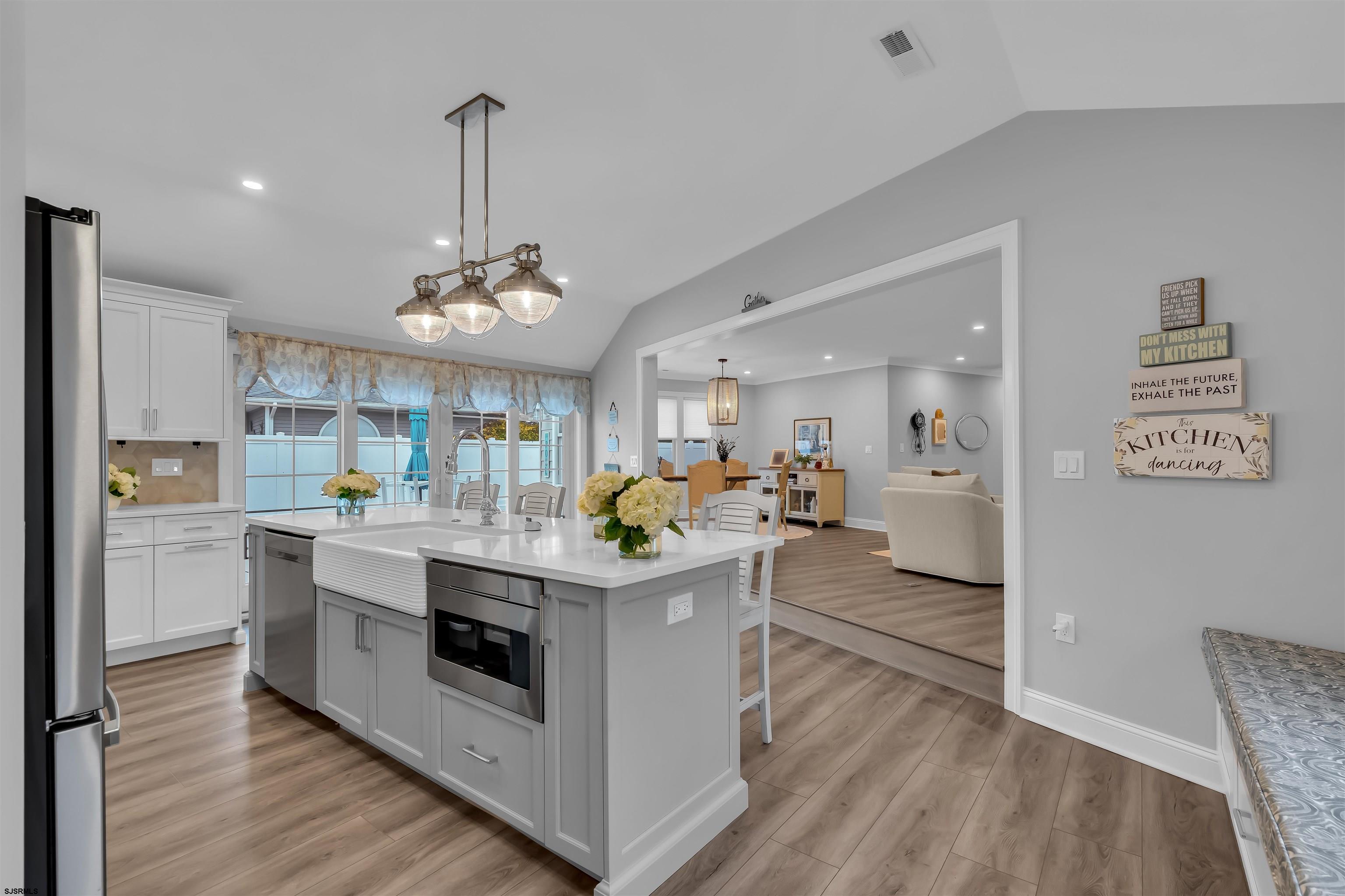 1610 Shore Road Linwood, NJ 08221 - Photo 18 of 46 a kitchen with stainless steel appliances granite countertop a stove oven and a refrigerator