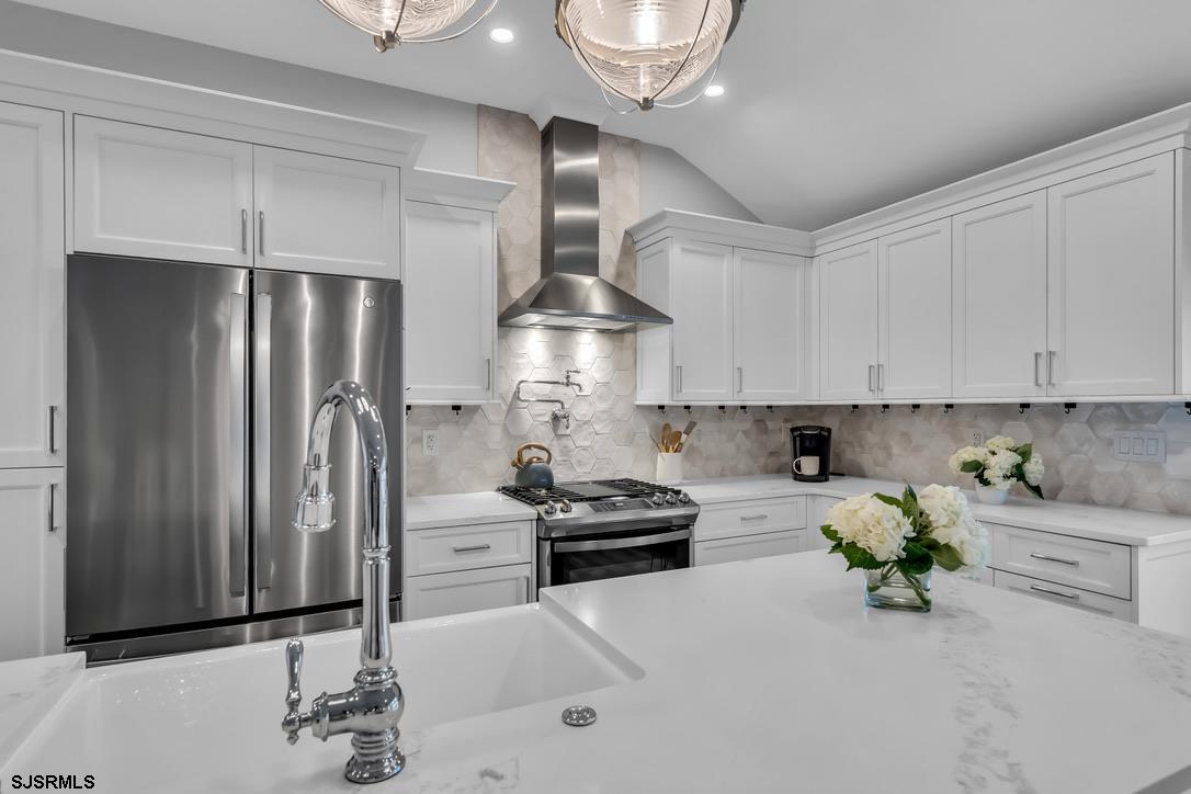 1610 Shore Road Linwood, NJ 08221 - Photo 19 of 46 a kitchen with stainless steel appliances a refrigerator sink and cabinets