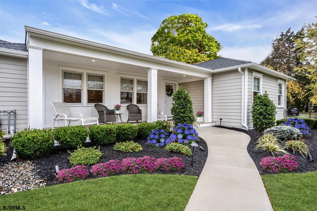 1610 Shore Road Linwood, NJ 08221 - Photo 2 of 46 a front view of house and yard with beautiful flowers