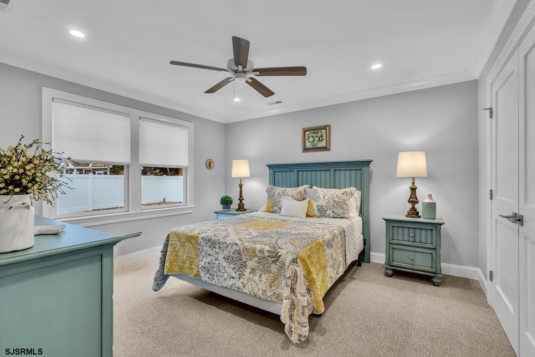 1610 Shore Road Linwood, NJ 08221 - Photo 28 of 46 a bedroom with a bed chandelier and a window