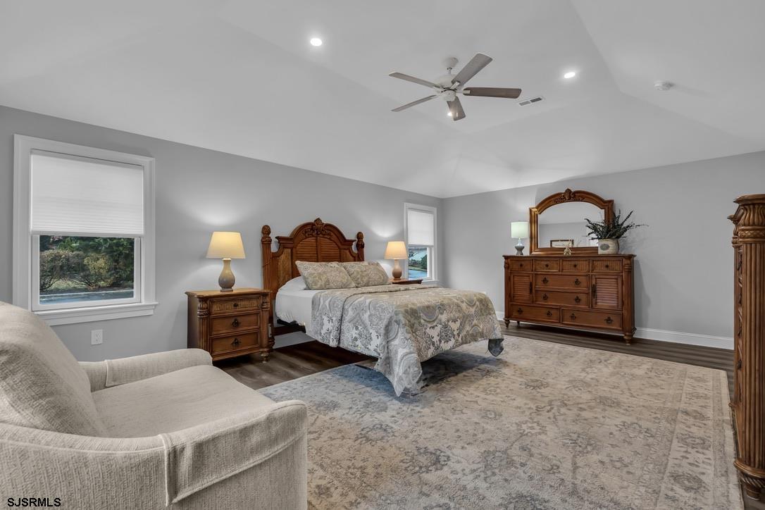 1610 Shore Road Linwood, NJ 08221 - Photo 33 of 46 a spacious bedroom with a bed a couch and a window