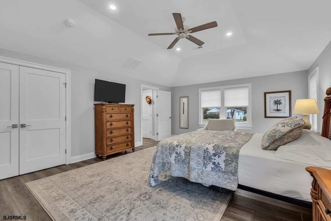 1610 Shore Road Linwood, NJ 08221 - Photo 34 of 46 a bedroom with a bed a ceiling fan and a dresser