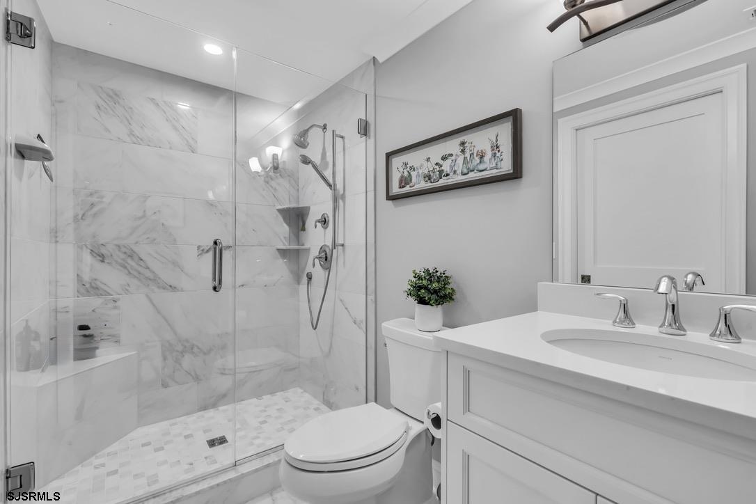 1610 Shore Road Linwood, NJ 08221 - Photo 35 of 46 a bathroom with a sink a toilet and shower