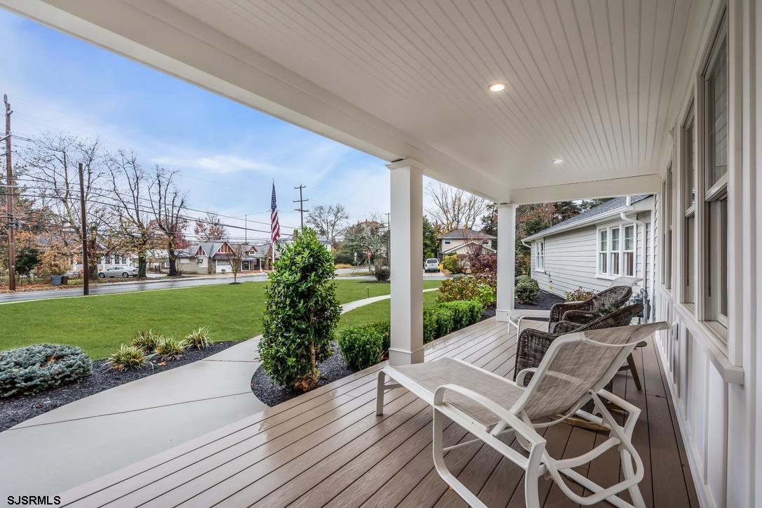 1610 Shore Road Linwood, NJ 08221 - Photo 4 of 46 a view of a patio with table and chairs potted plants with wooden floor