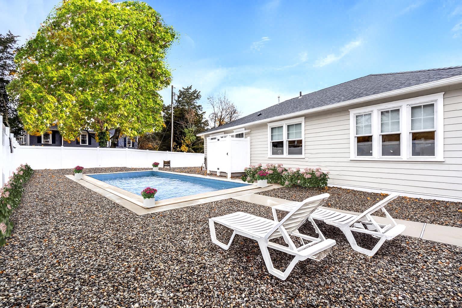 1610 Shore Road Linwood, NJ 08221 - Photo 42 of 46 a view of a patio with table and chairs with wooden fence