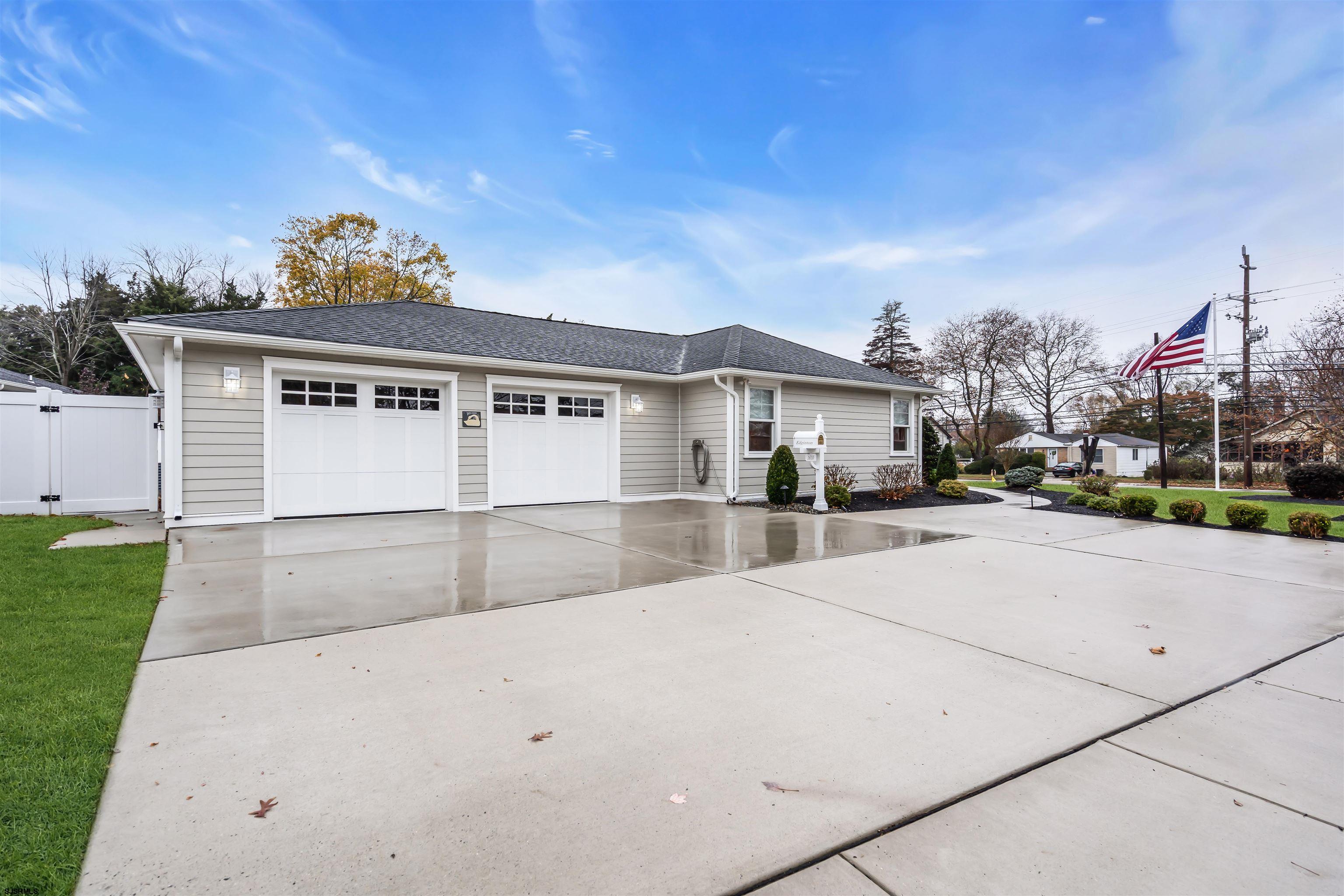 1610 Shore Road Linwood, NJ 08221 - Photo 45 of 46 a front view of a house with a yard and garage
