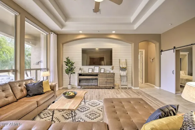a living room with furniture and a fireplace