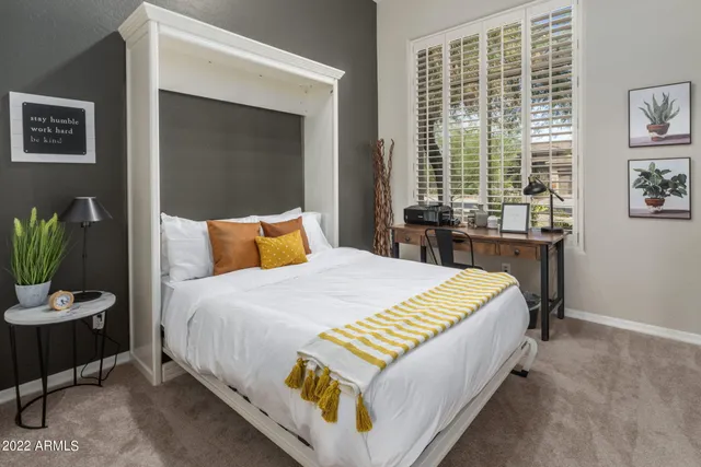 a view of swimming pool with seating area and trees around