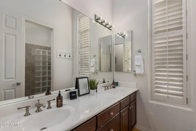 a front view of a house with swimming pool yard patio and outdoor seating