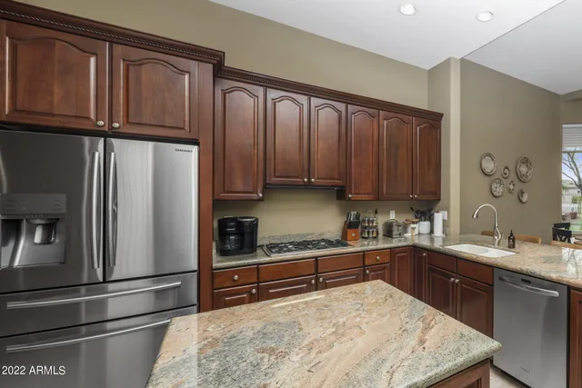 a room with pool table and windows