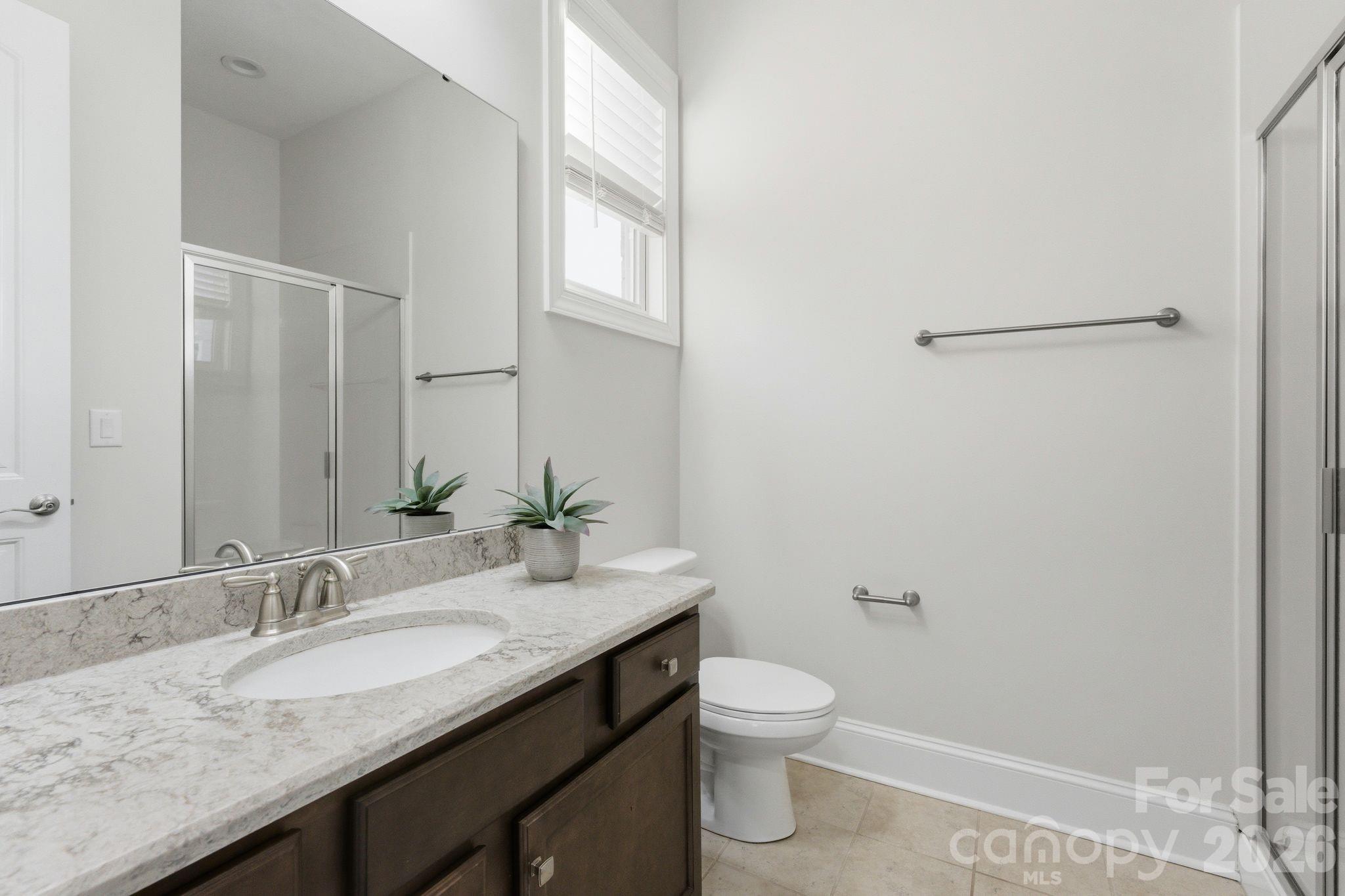 374 Hampton Trail Drive Fort Mill, SC 29708 - Photo 23 of 46 a bathroom with a granite countertop sink a toilet and a mirror