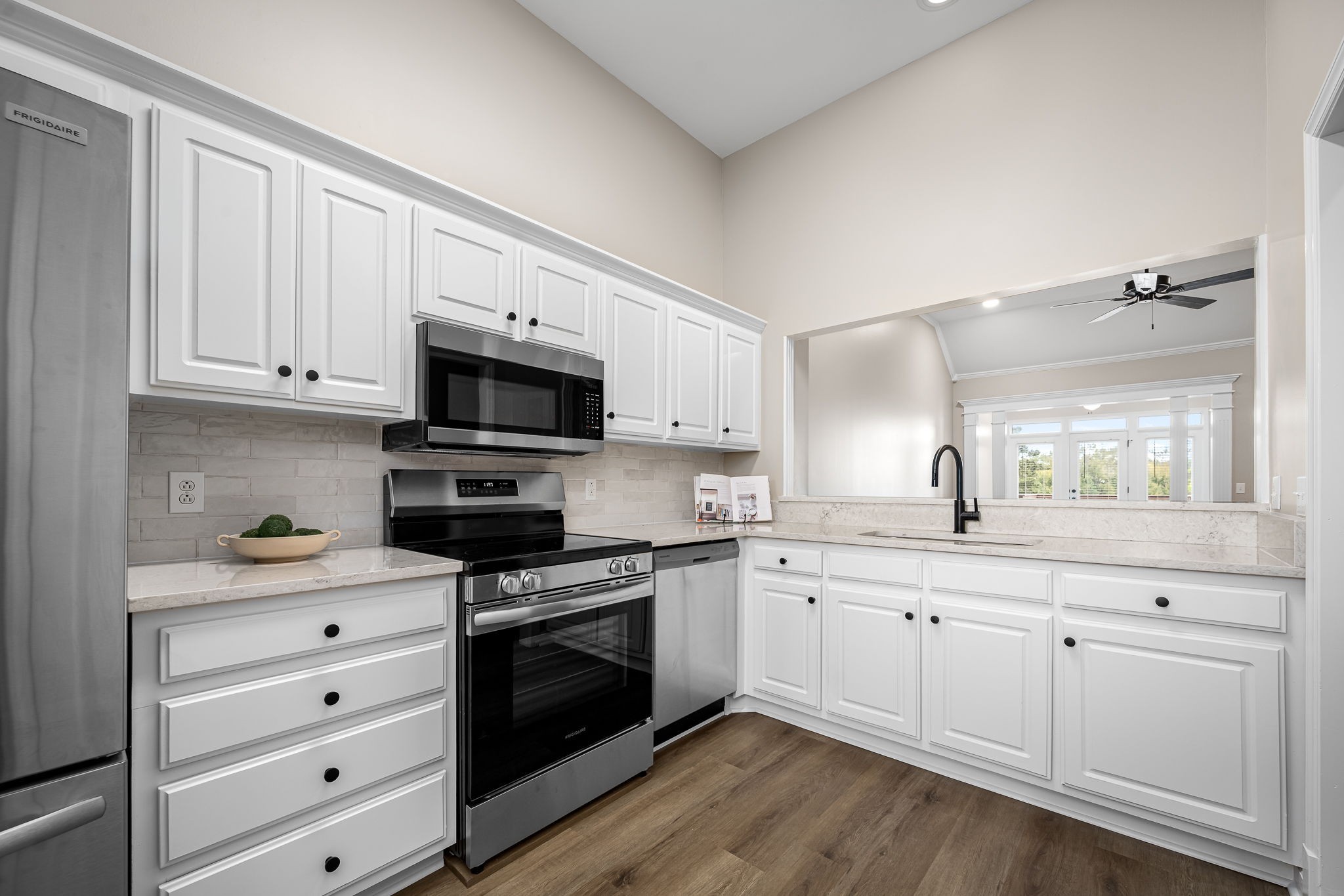 339 Calumet Trace Murfreesboro, TN 37127 - Photo 11 of 24 a kitchen with granite countertop white cabinets white stainless steel appliances and sink