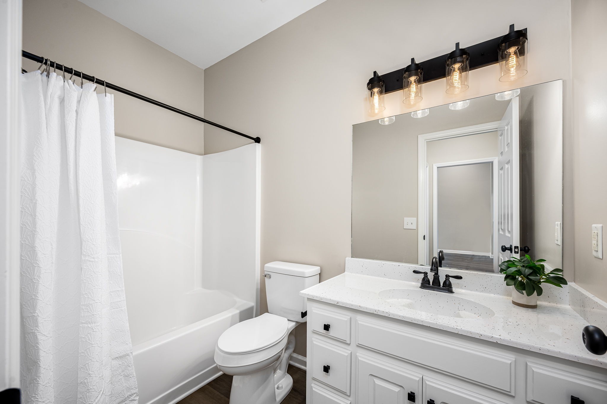 339 Calumet Trace Murfreesboro, TN 37127 - Photo 21 of 24 a bathroom with a sink a toilet a mirror a vanity and shower