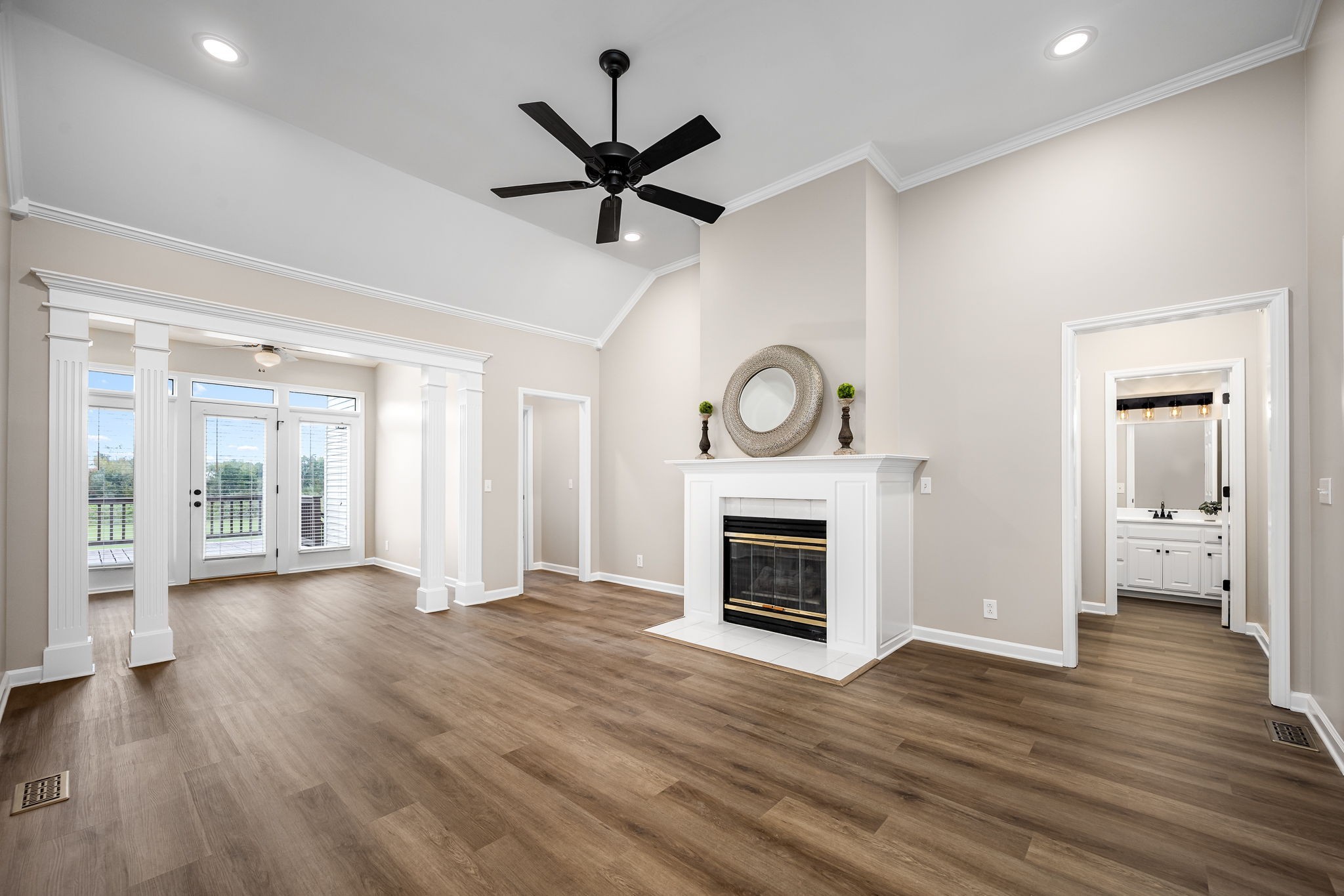 339 Calumet Trace Murfreesboro, TN 37127 - Photo 4 of 24 a view of an empty room with window wooden floor and a fireplace