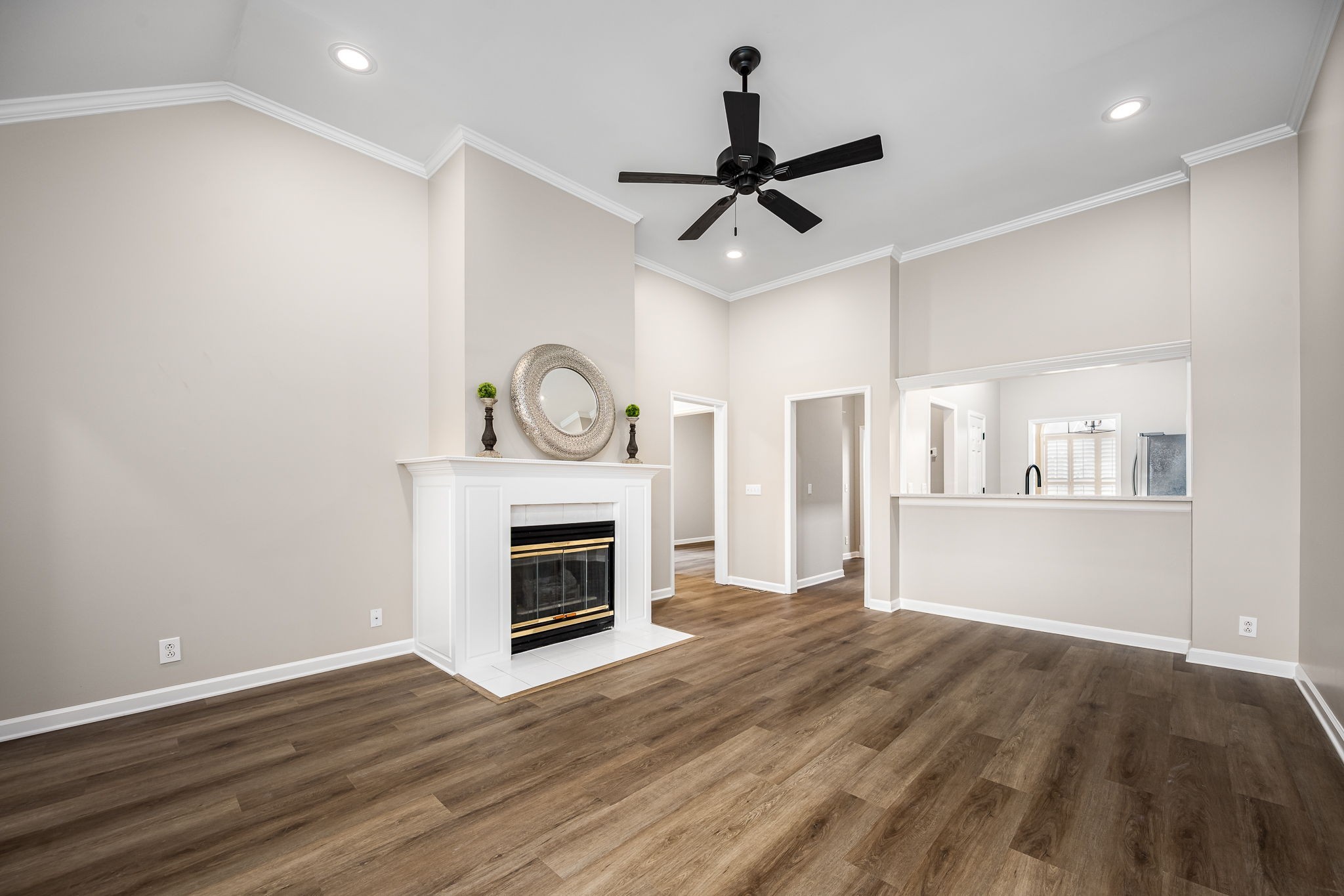 339 Calumet Trace Murfreesboro, TN 37127 - Photo 5 of 24 a view of wooden floor a refrigerator and a fireplace in a room