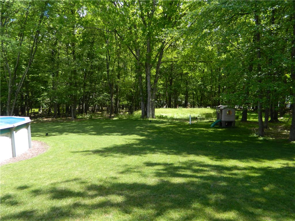 328 Pin Oak Road Stroudsburg, PA 18360 - Photo 7 of 37 A verdant lawn provides ample space for recreation, bordered by mature shade trees.