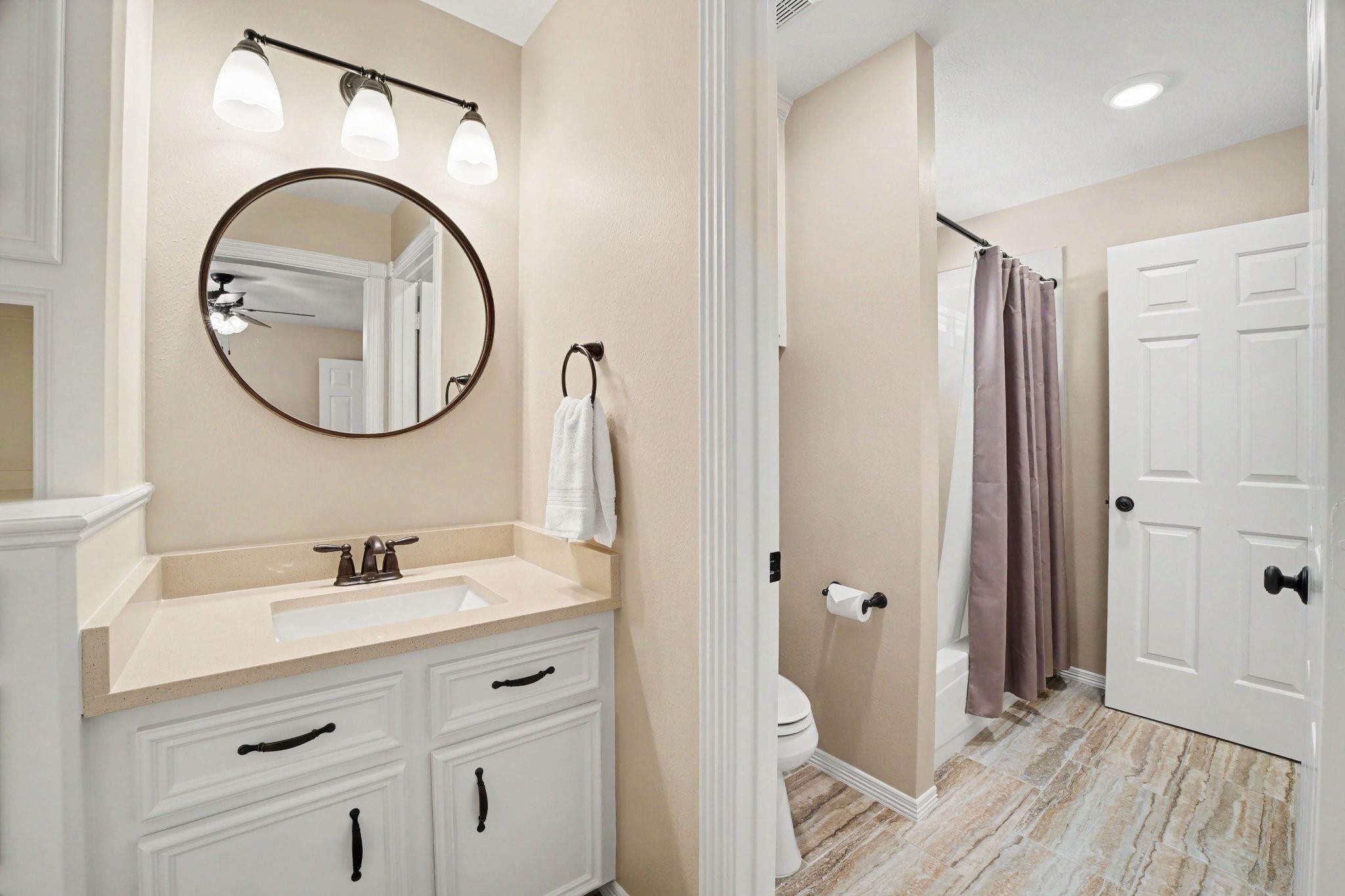 3411 Fir Forest Drive Spring, TX 77388 - Photo 29 of 39 A view of secondary bedroom 1's updated sink area looking into the Jack and Jill bathroom that connects secondary bedroom 2 on the other side. The large walk-in closet is to the left of the sink.