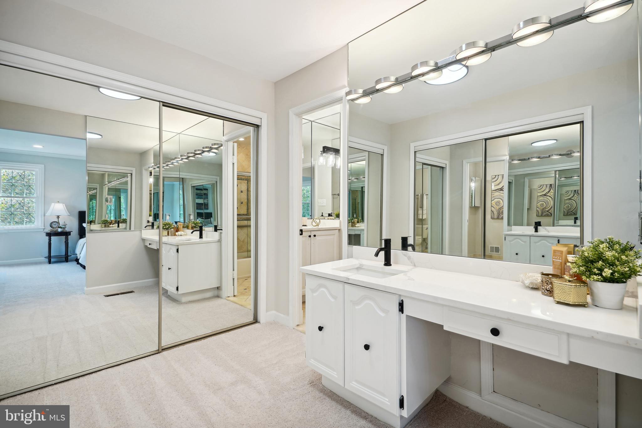 5809 Tudor Lane Rockville, MD 20852 - Photo 13 of 42 Primary bathroom vanity and closets
