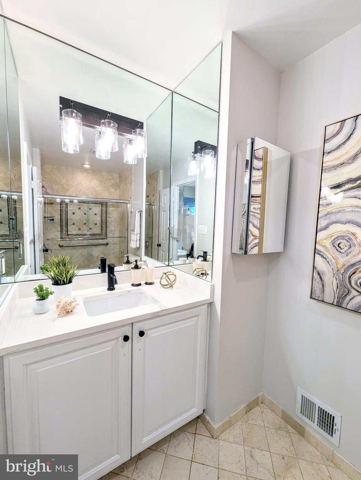 5809 Tudor Lane Rockville, MD 20852 - Photo 14 of 42 Primary Bathroom - carrara quartz counters, lights