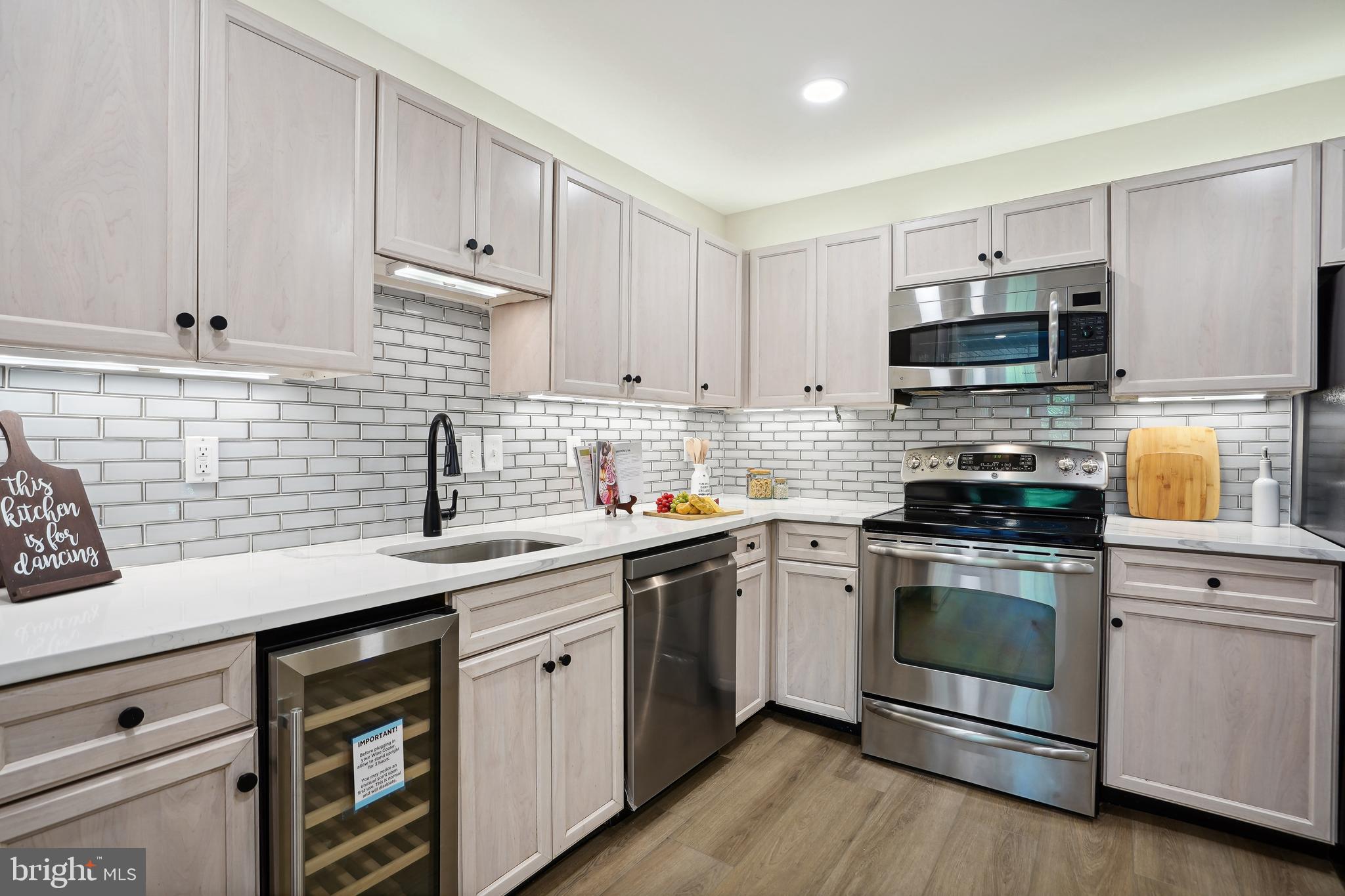 5809 Tudor Lane Rockville, MD 20852 - Photo 4 of 42 Kitchen - new counters, backsplash, wine fridge