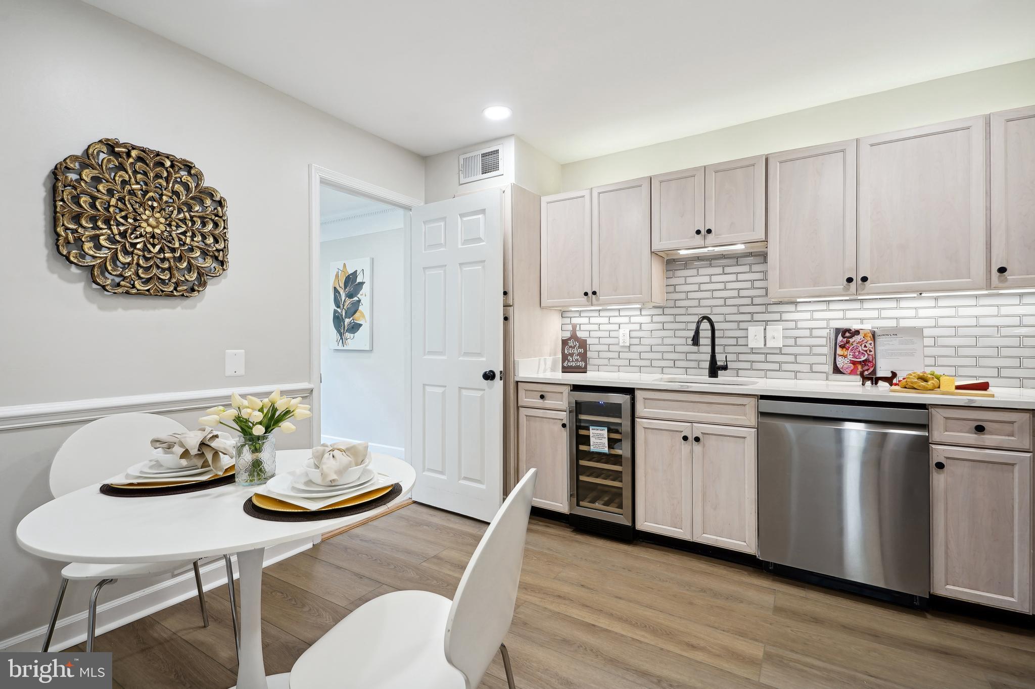 5809 Tudor Lane Rockville, MD 20852 - Photo 5 of 42 Kitchen - new floors, recessed lights, dishwasher
