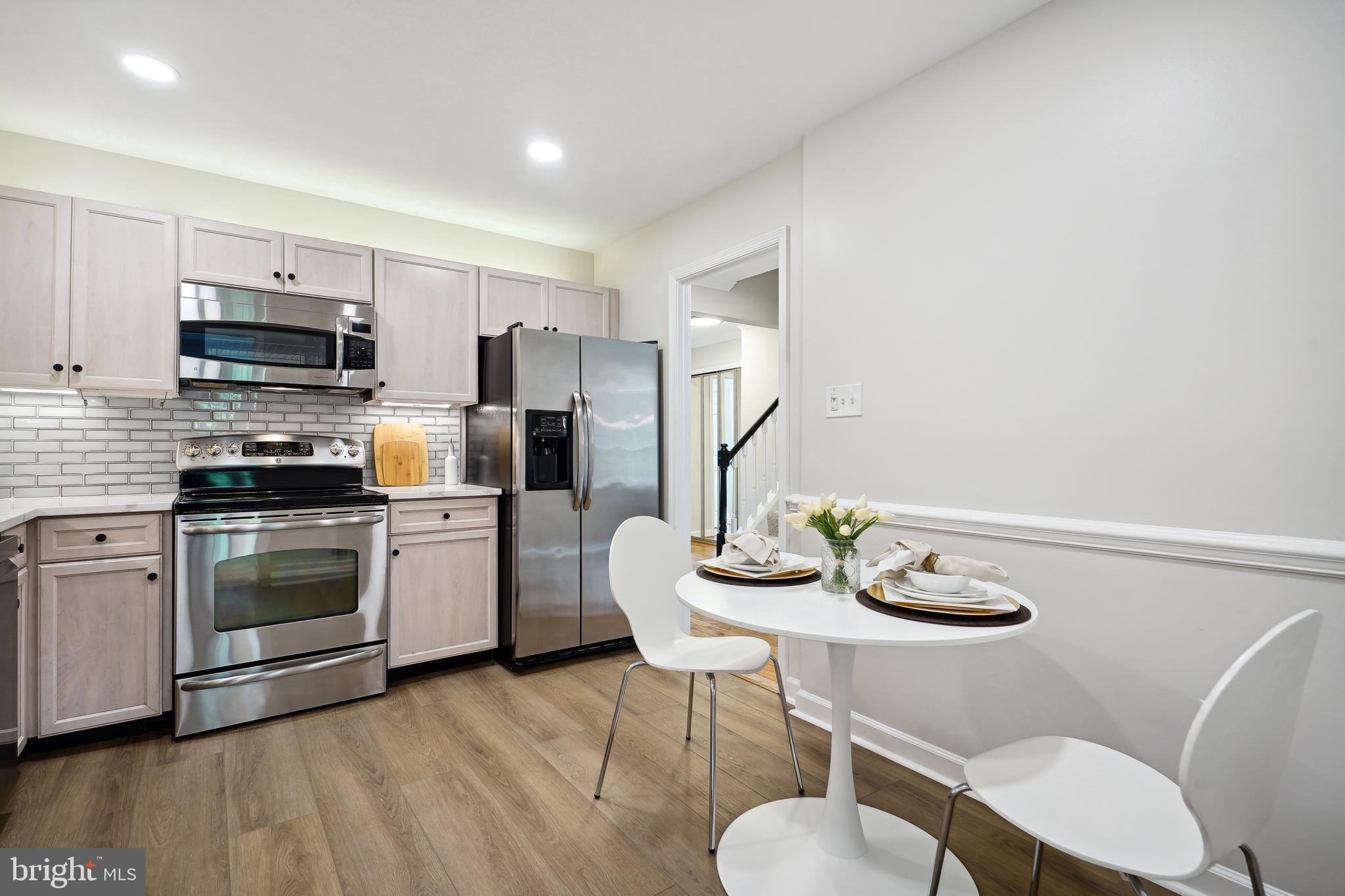 5809 Tudor Lane Rockville, MD 20852 - Photo 6 of 42 Kitchen - carrara quartz counters, new floors