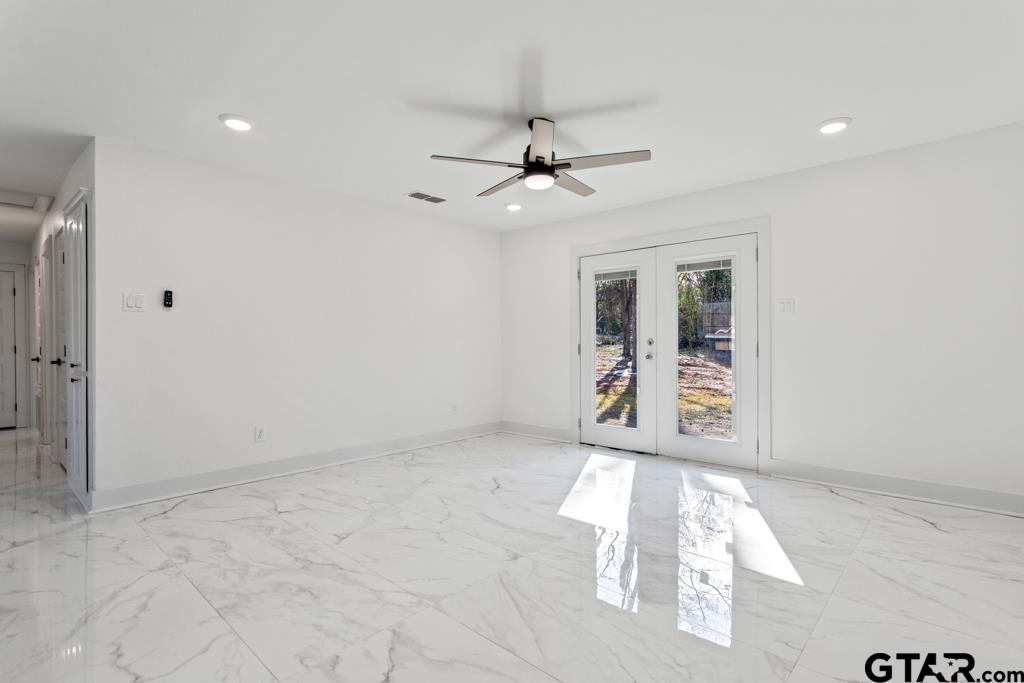 1608 Austin Drive Tyler, TX 75701 - Photo 14 of 36 a view of an empty room with a window