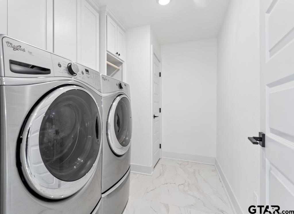 1608 Austin Drive Tyler, TX 75701 - Photo 30 of 36 a view of a storage & utility room with a washer dryer