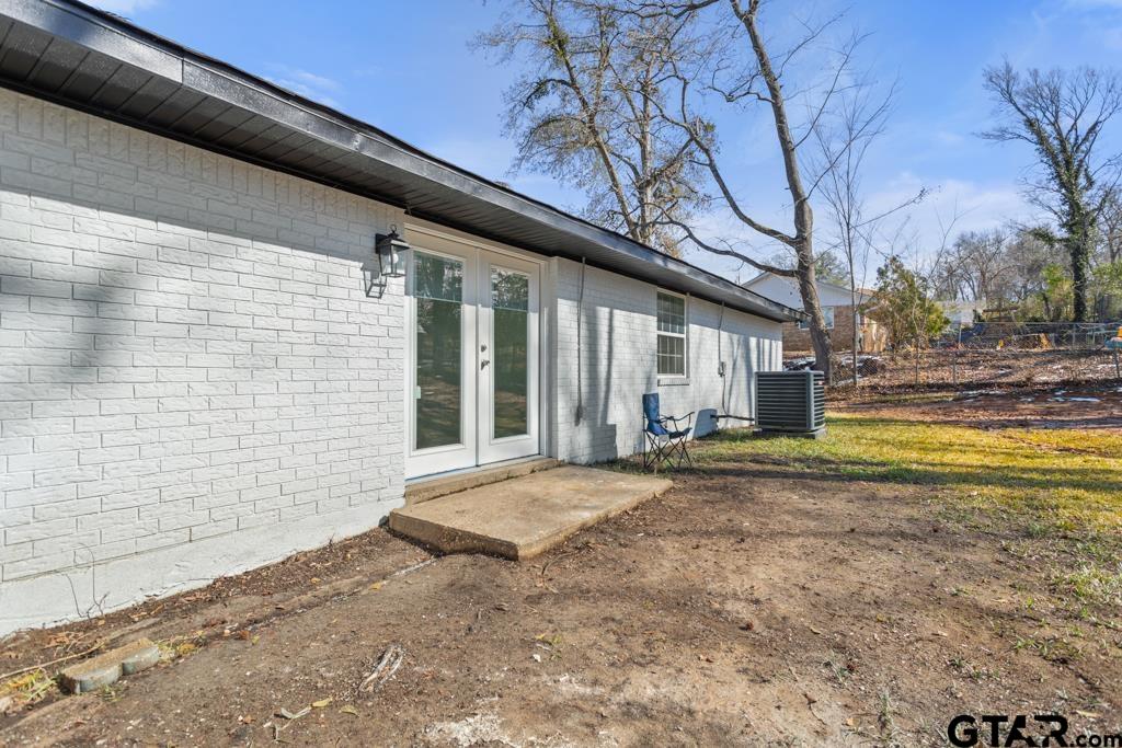 1608 Austin Drive Tyler, TX 75701 - Photo 31 of 36 a view of backyard with large trees
