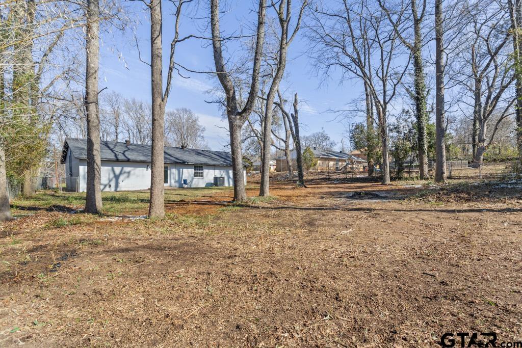 1608 Austin Drive Tyler, TX 75701 - Photo 34 of 36 a view of dirt yard with a large tree
