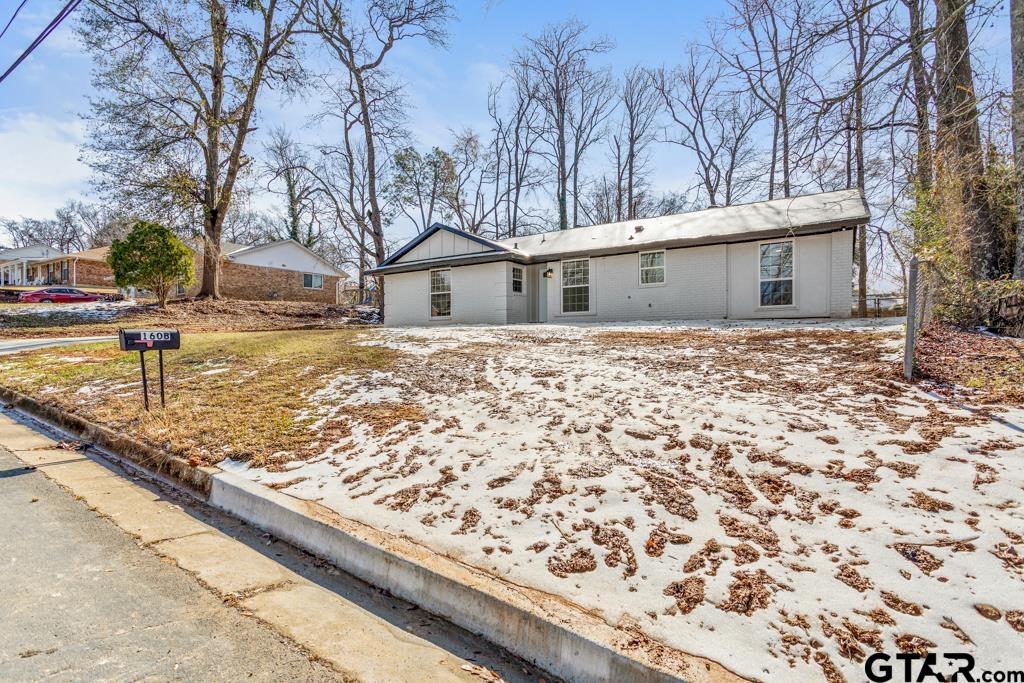1608 Austin Drive Tyler, TX 75701 - Photo 36 of 36 a white house that has a tree in front of it
