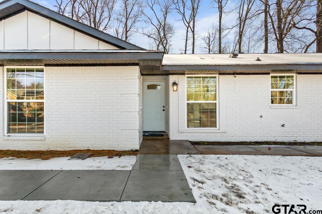 1608 Austin Drive Tyler, TX 75701 - Photo 4 of 36 a front view of a house with a yard