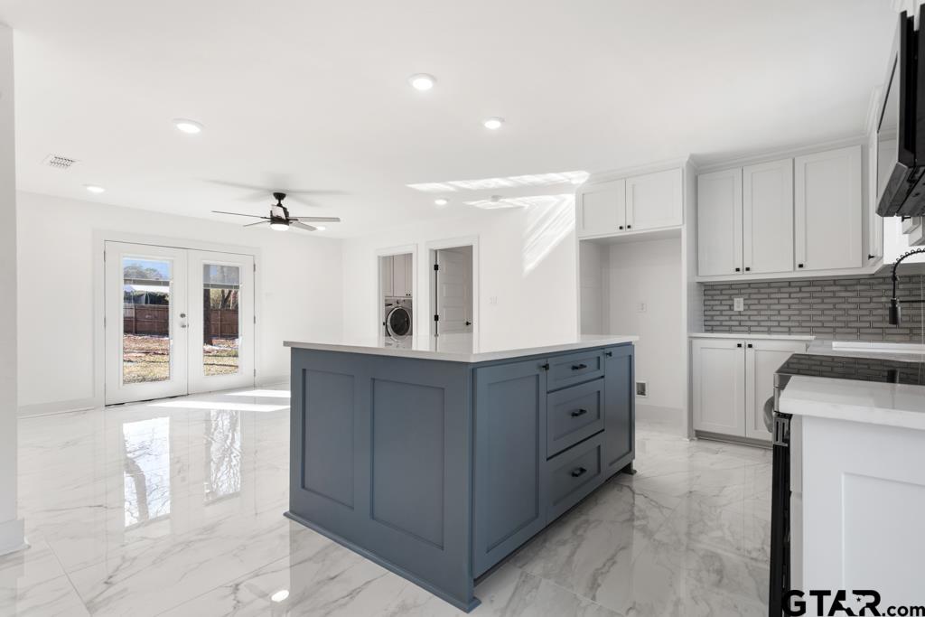 1608 Austin Drive Tyler, TX 75701 - Photo 9 of 36 a kitchen with cabinets a sink and appliances