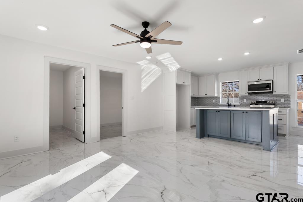 1608 Austin Drive Tyler, TX 75701 - Photo 10 of 36 a view of kitchen with cabinets and window