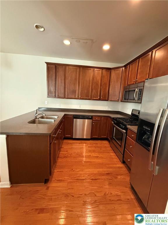 1805 Hemming Way Orefield, PA 18069 - Photo 2 of 24 a kitchen with wooden cabinets a sink and a stove