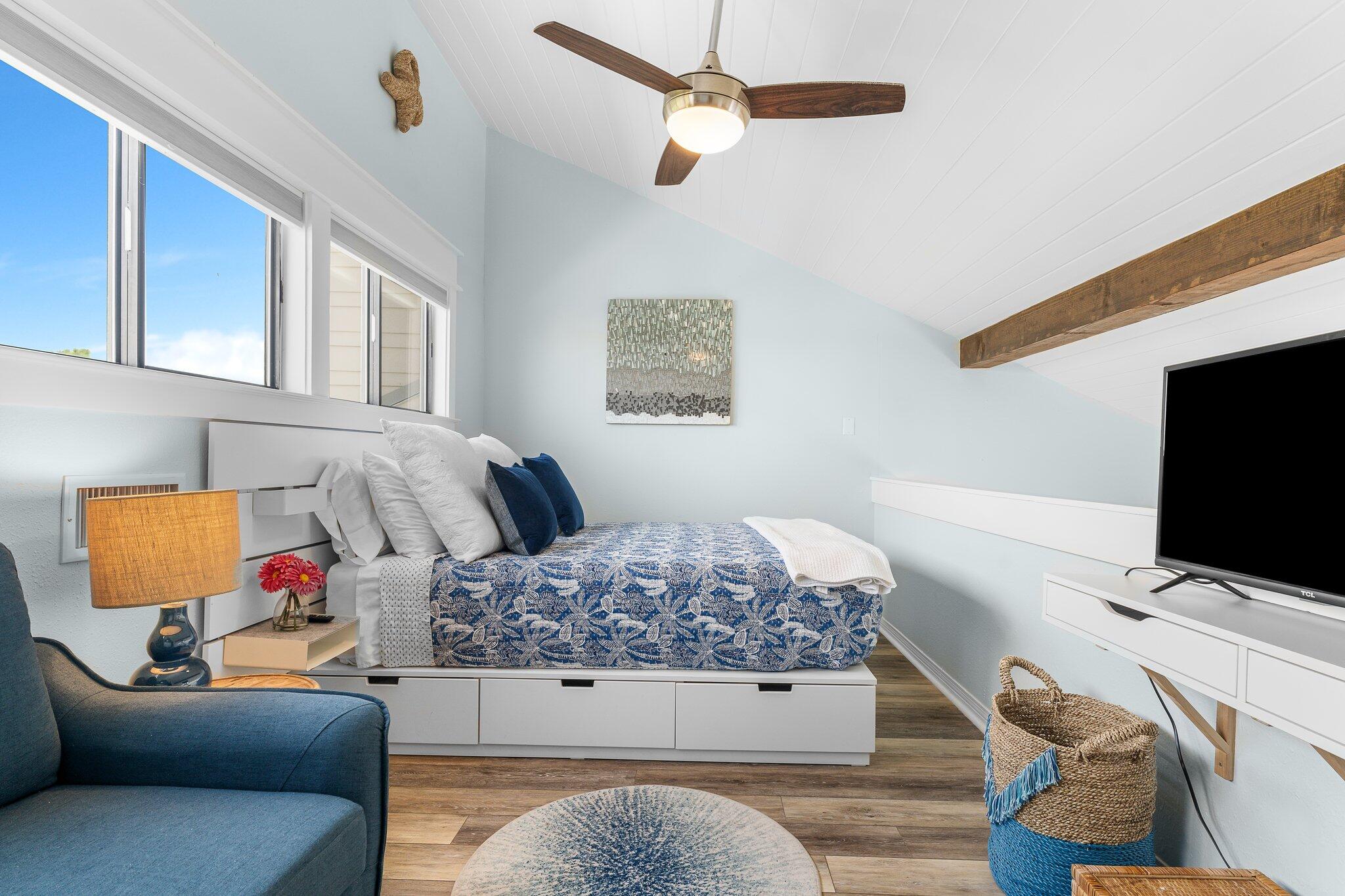 145 Beachfront Trail, Unit 302 Santa Rosa Beach, FL 32459 - Photo 17 of 42 a bedroom with a bed and flat screen tv