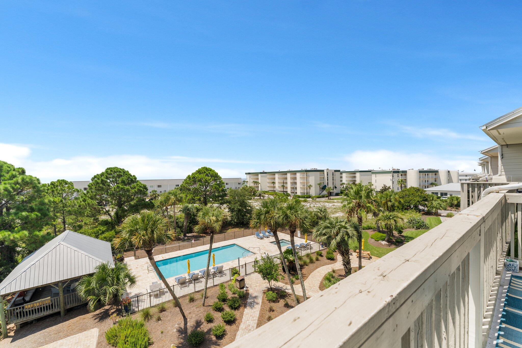 145 Beachfront Trail, Unit 302 Santa Rosa Beach, FL 32459 - Photo 21 of 42 a view of a balcony with wooden floor and fence