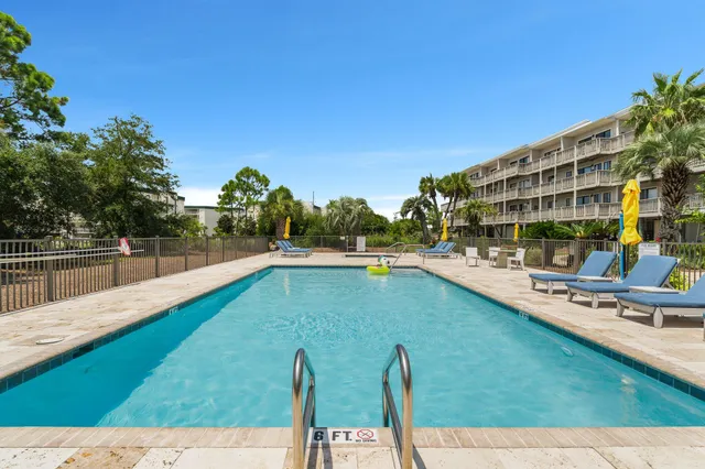 a view of swimming pool with chairs